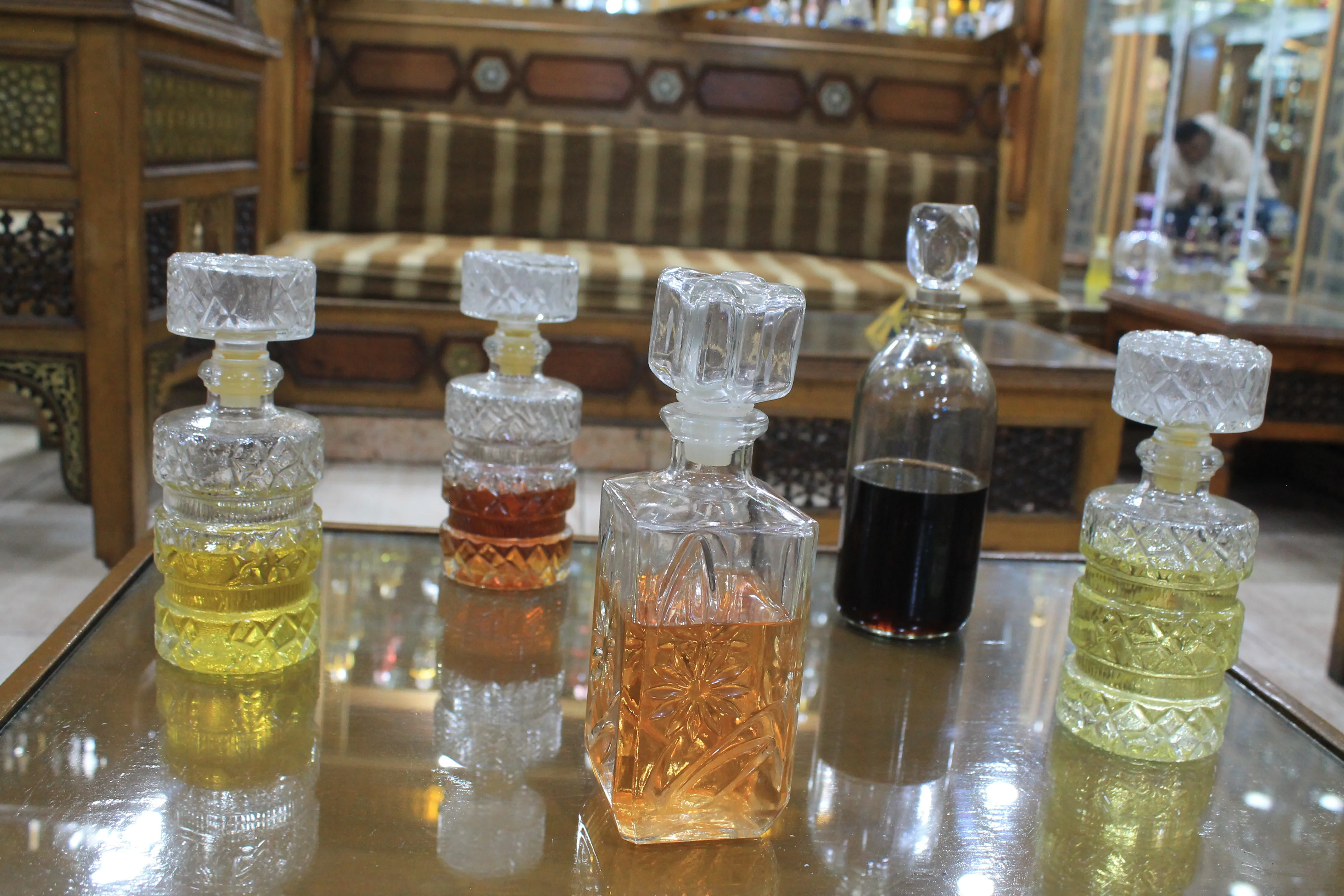 Decanters of our pure, cold-pressed essence oils, filled with the scents of history and civilization.